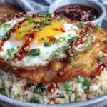 crispy fried egg over garlic rice - featured image